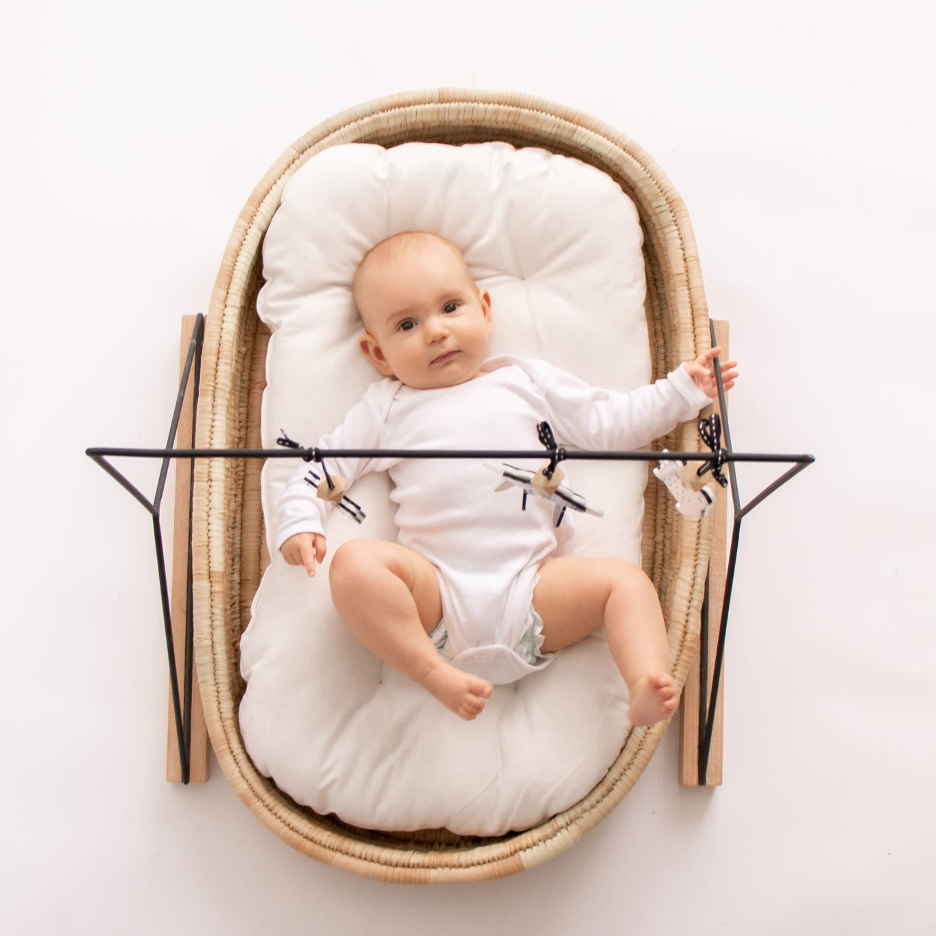 Baby in a Changing basket on a merino moses mattress