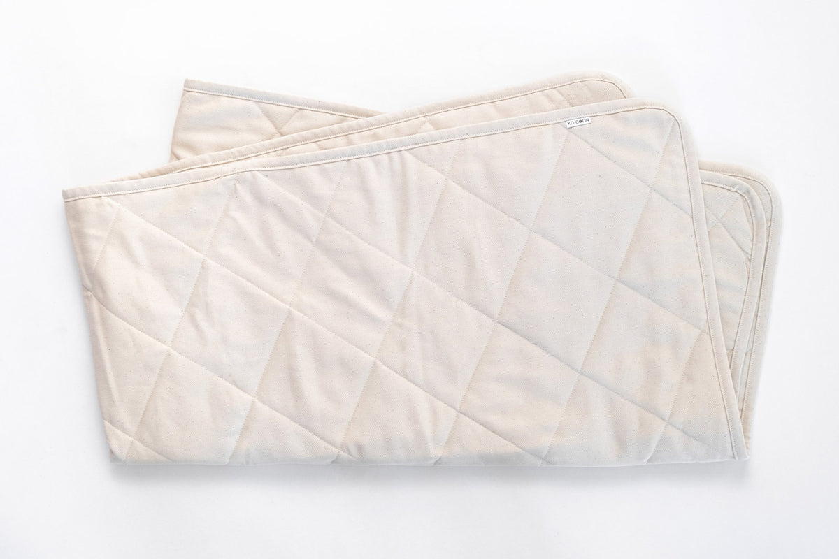 Merino quilted mattress padding protector Puddle Pad kocoon